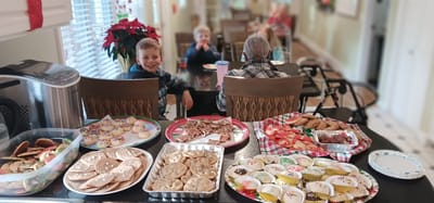 Residents enjoying baked goods in a common area
