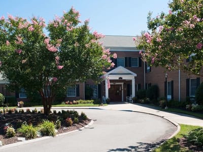 Exterior view of the facility with landscaped entrance