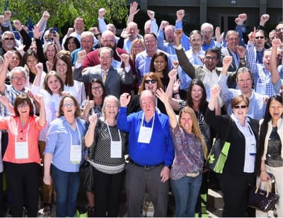 Large group of people celebrating outdoors