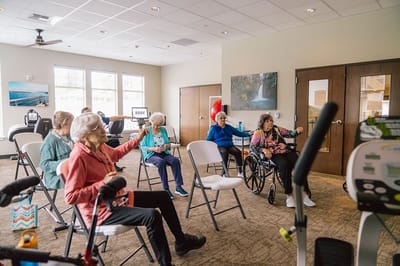 Residents participating in a wellness activity in a bright common area