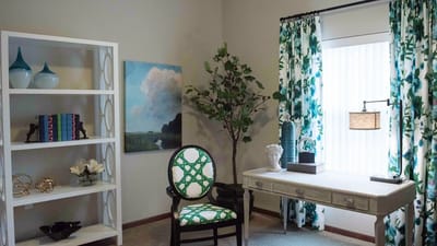 A beautifully decorated interior room with plants and decorative elements