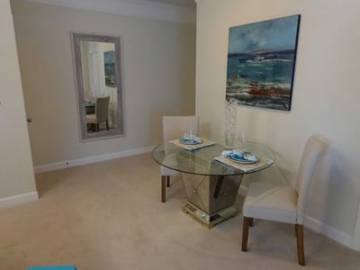 Interior shot of a dining area with a table and chairs