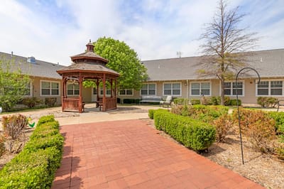 A gazebo in a landscaped outdoor area
