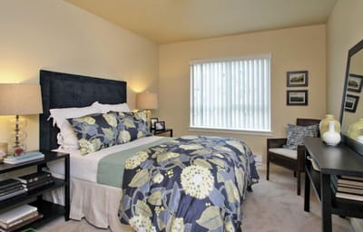 Cozy resident bedroom with floral bedding and decor