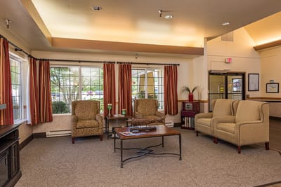 Bright common area with seating and large windows