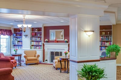 Interior view of a cozy common area with bookshelves