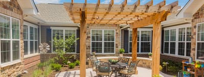 Outdoor patio area with seating and landscaping