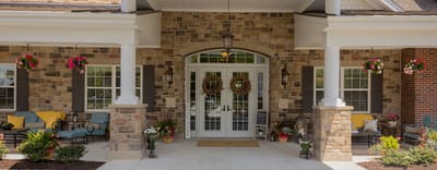 Exterior view of the facility entrance with flower decorations