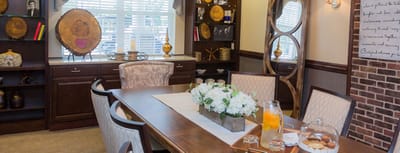Interior view of a cozy common area with a dining table