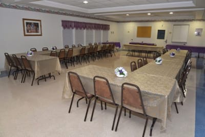 Interior view of a dining area with tables set up