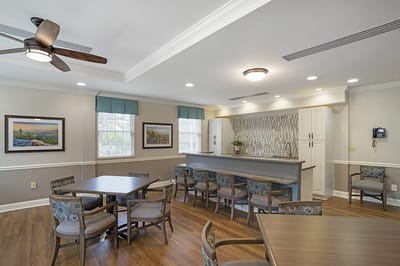 Bright common area with seating and kitchenette