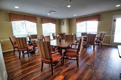 Bright dining room with tables and chairs