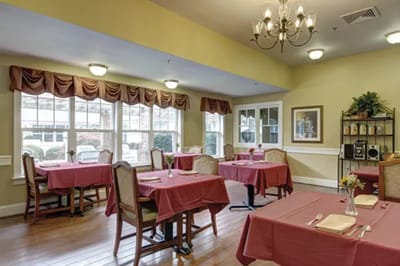 Dining area with tables set for residents