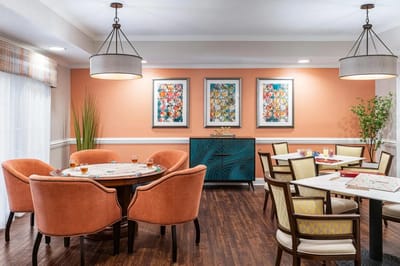 Bright common area with colorful artwork and seating