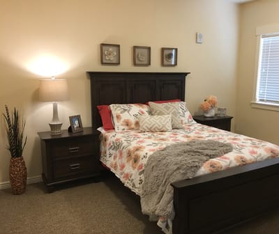 Cozy private resident room with floral bedding