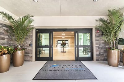 Entrance to Discovery Village with potted plants