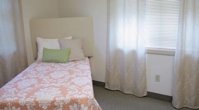 Cozy private resident room with floral bedding