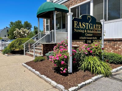 Entrance of Eastgate Nursing & Rehabilitation Center with flowers