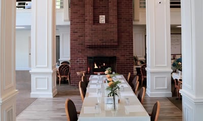 Dining area with a fireplace and elegant table setting