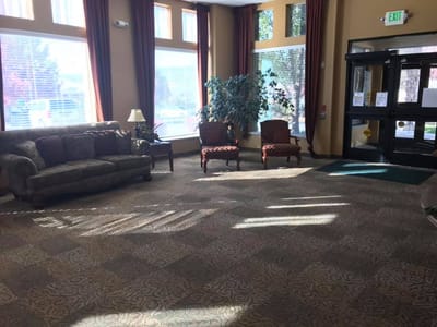 Interior common area with a couch and chairs