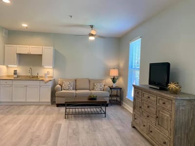 Cozy interior living space with a sofa and kitchenette