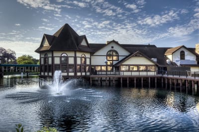 Exterior view of a senior living facility by the water