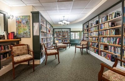Cozy library area with bookshelves and seating