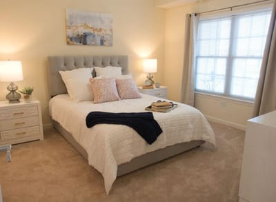 Cozy private resident room with a bed and natural light