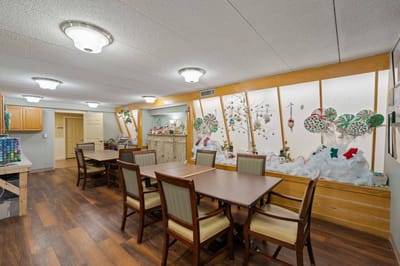 Common area with tables and festive decorations