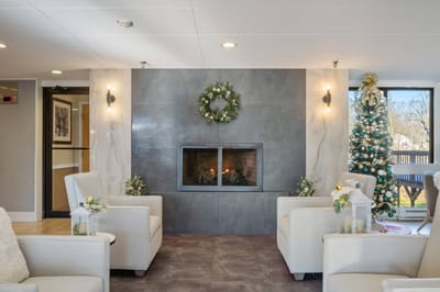 Cozy common area with fireplace and holiday decorations