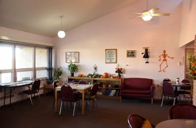 Common area with tables, chairs, and decorations