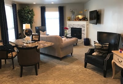 Common area with seating and a fireplace