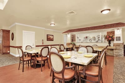 Dining area set up with tables and chairs
