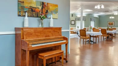 Interior view of a dining area with a piano