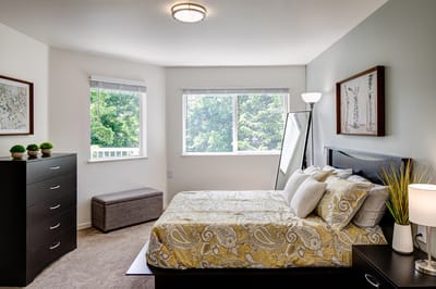 Bright and inviting resident room with a cozy bed