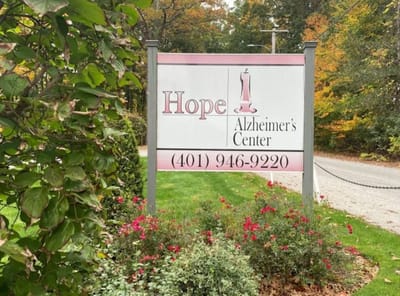 Sign for Hope Alzheimer's Center with floral landscaping