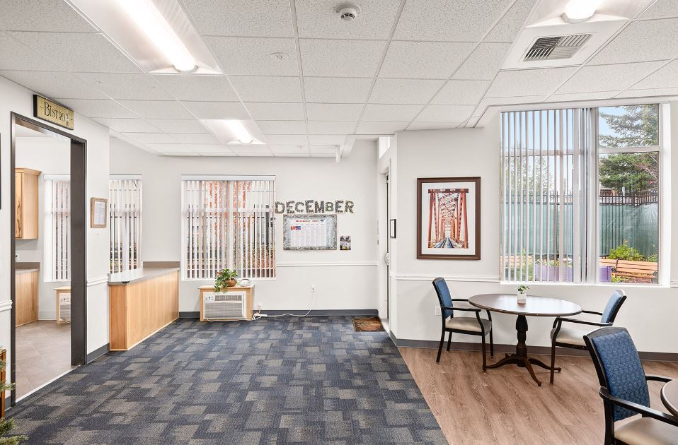 Bright common area with a decorative calendar and seating