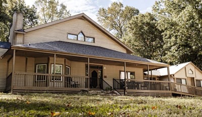 Exterior view of the assisted living facility with a porch