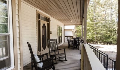 Outdoor porch area with rocking chairs