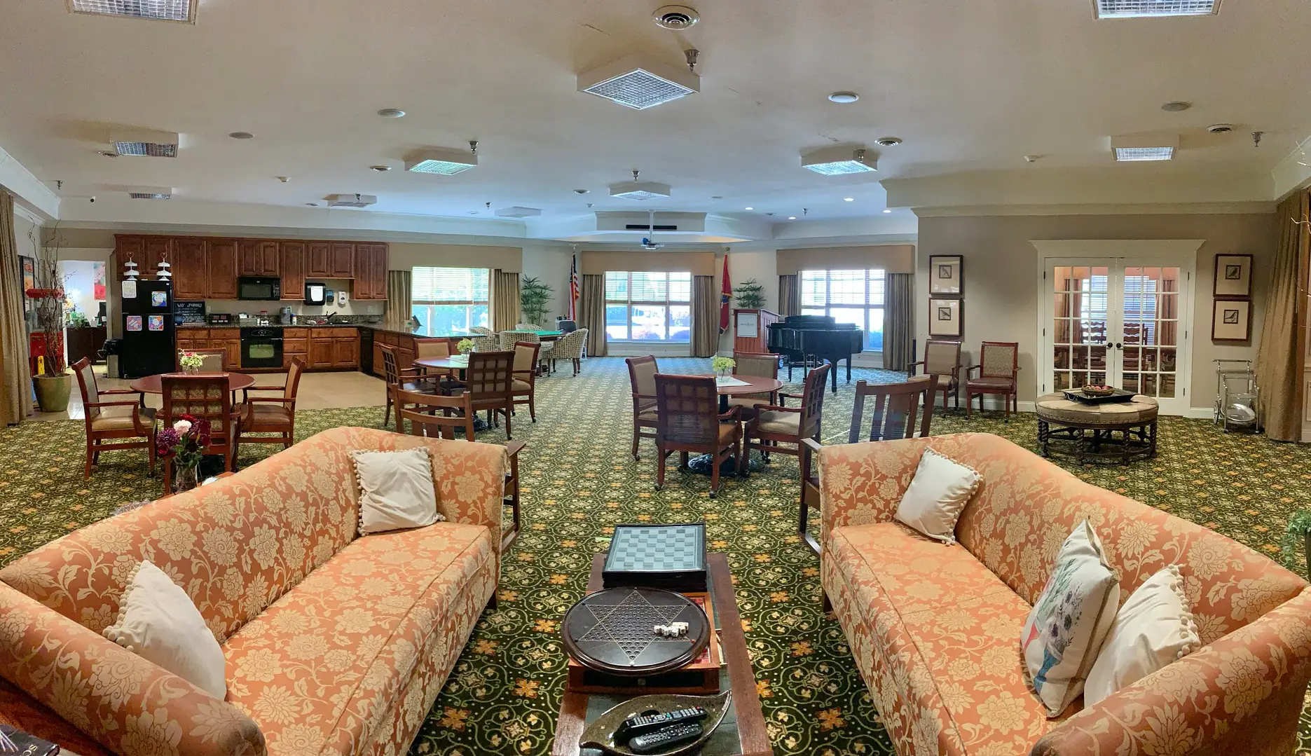 Elegant common area with sofas and a piano