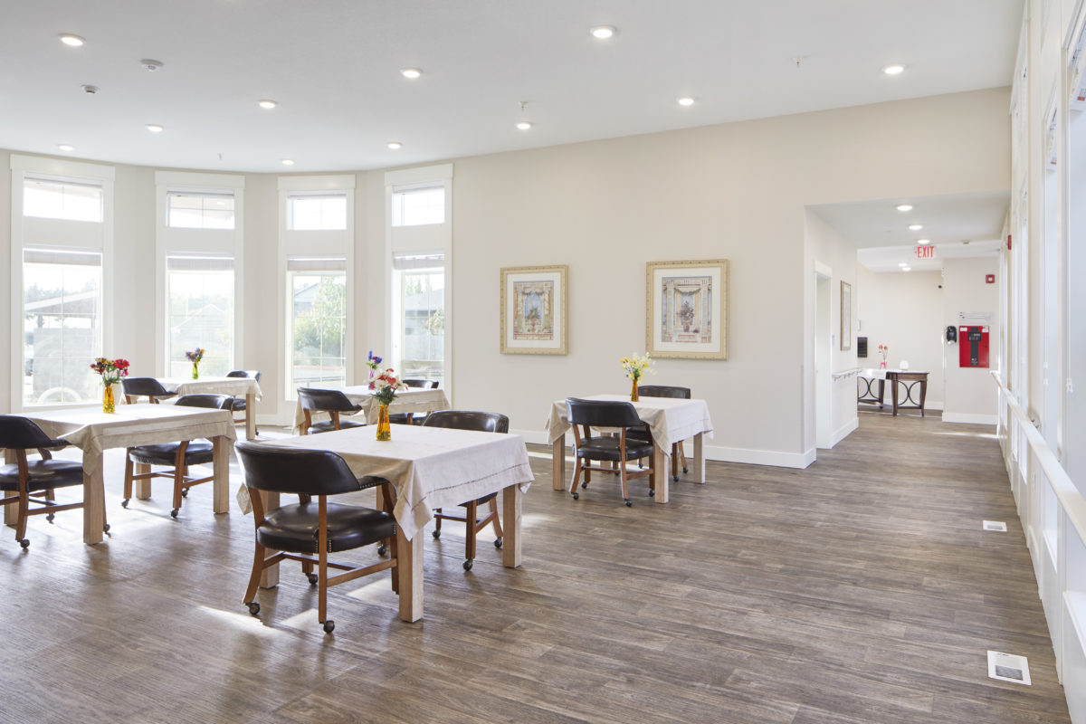 Bright dining room with tables and chairs