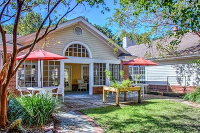 Outdoor seating area with tables and umbrellas