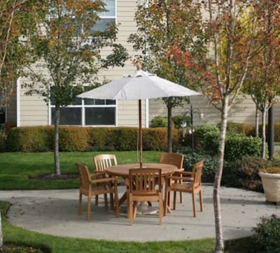 Outdoor seating area with a table and umbrella