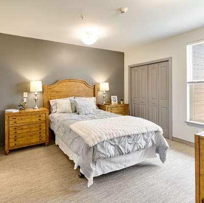 Cozy private resident room with a bed and decor
