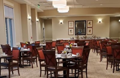 Dining area with tables set for breakfast