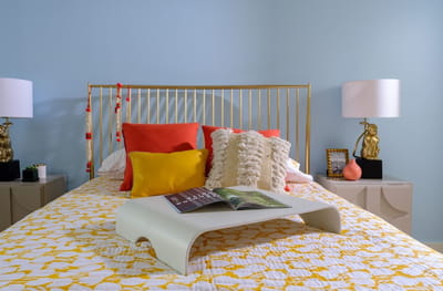 Cozy bedroom with colorful decor and cushions