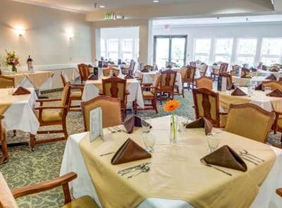 Well-set dining room with tables and chairs