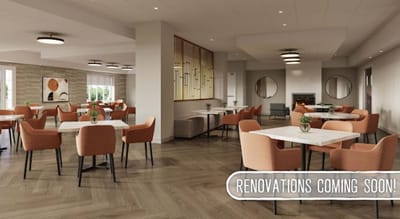 A modern dining room with orange chairs and tables