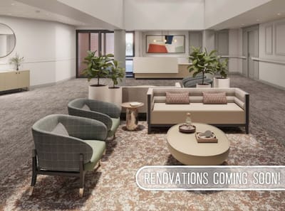Common area with seating and decor in a senior living facility