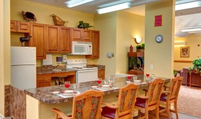 Interior view of a common area kitchen with seating
